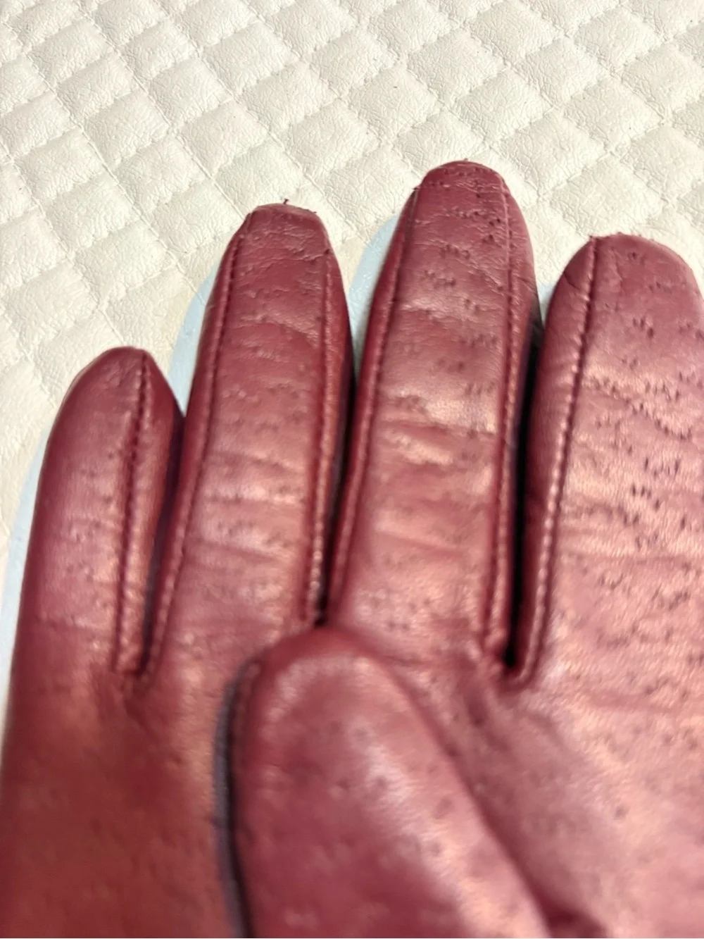 maroon leather gloves feature a distinctive textured perforated pattern 6.5